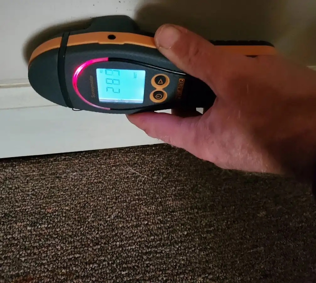 Moisture detection at baseboard during Burst Pipe Cleanup in Mecca